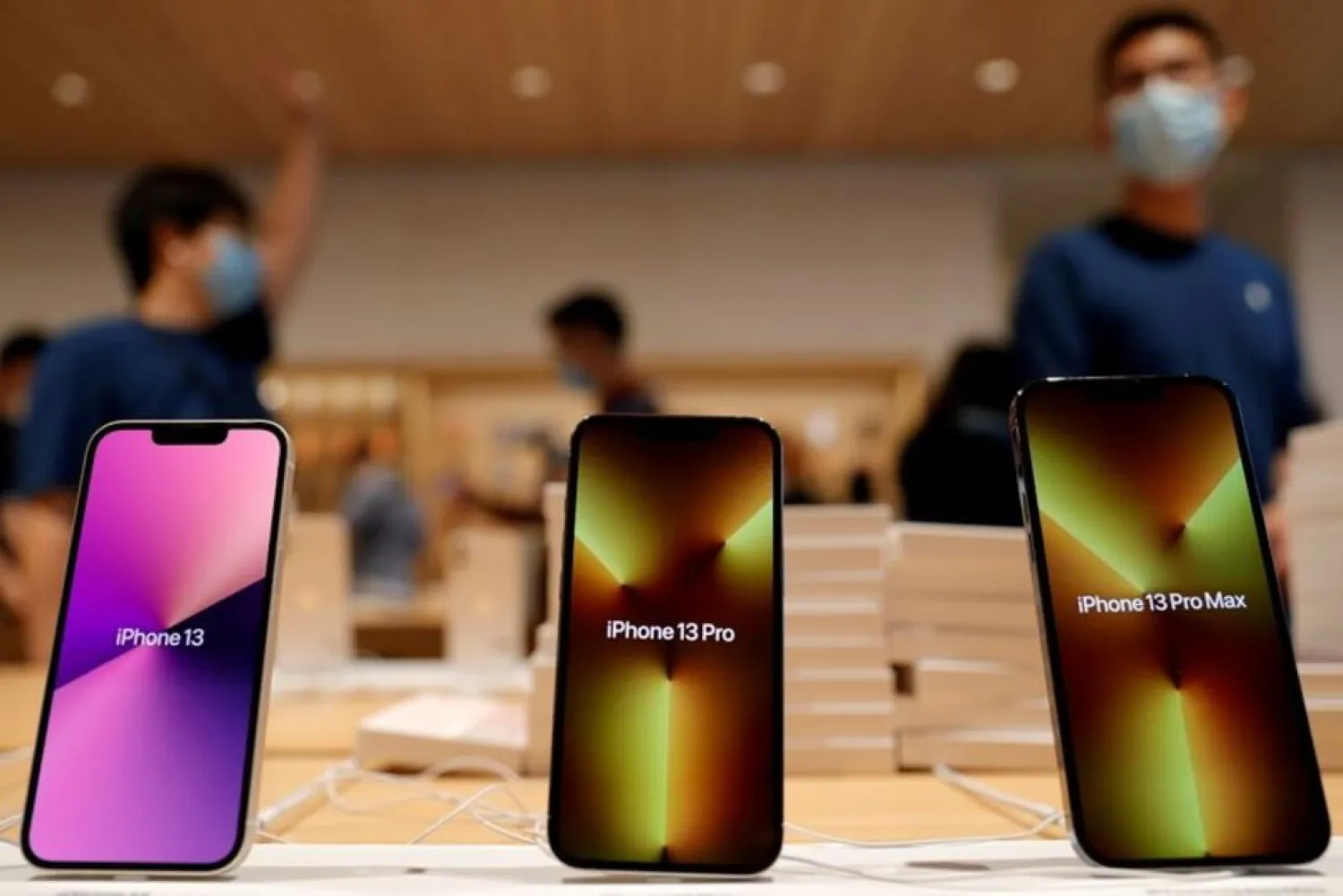 Apple's iPhone 13 models are pictured at an Apple Store on the day the new Apple iPhone 13 series goes on sale, in Beijing, China September 24, 2021. (Reuters)