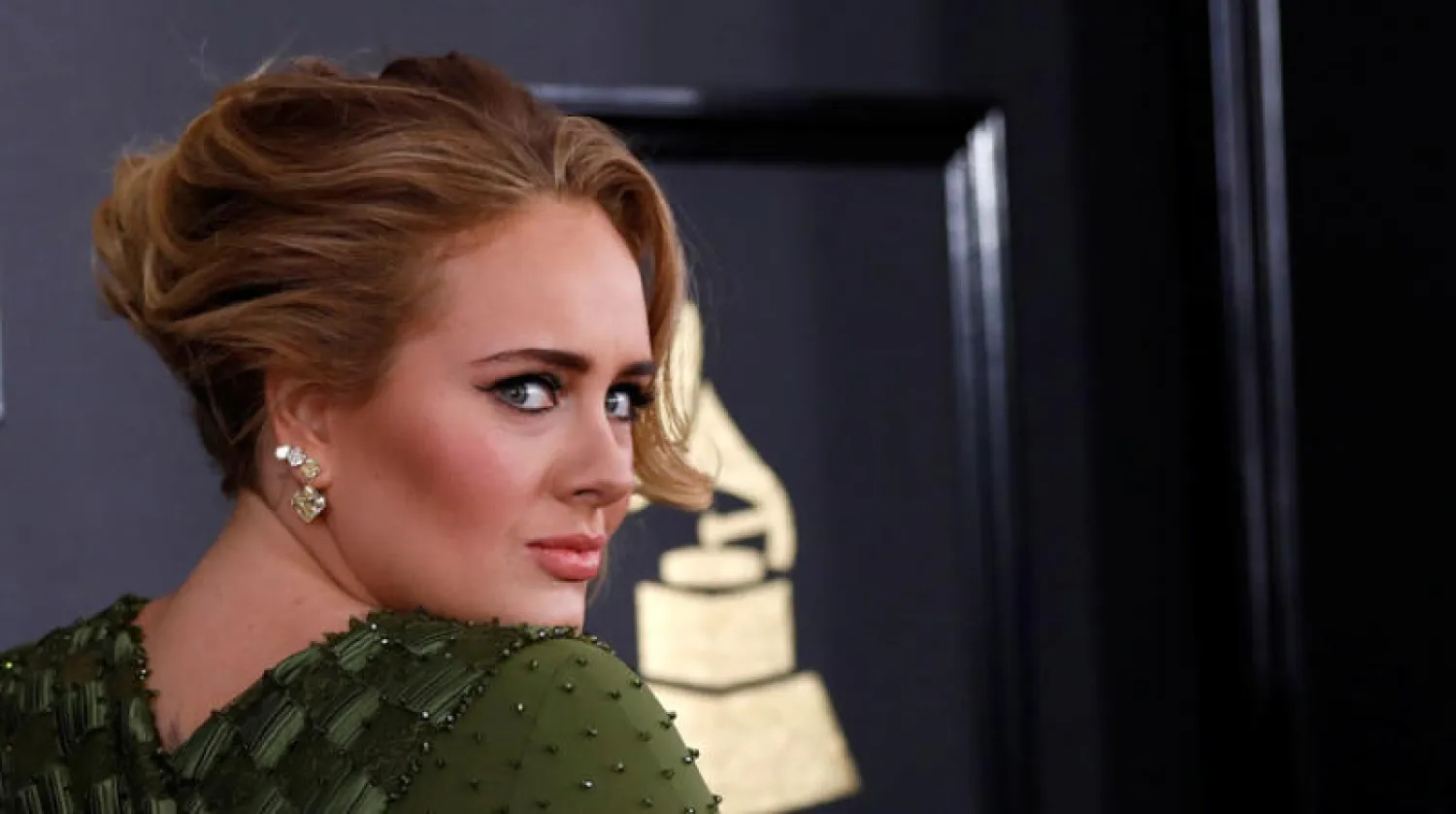 المغنية أديل (رويترز)