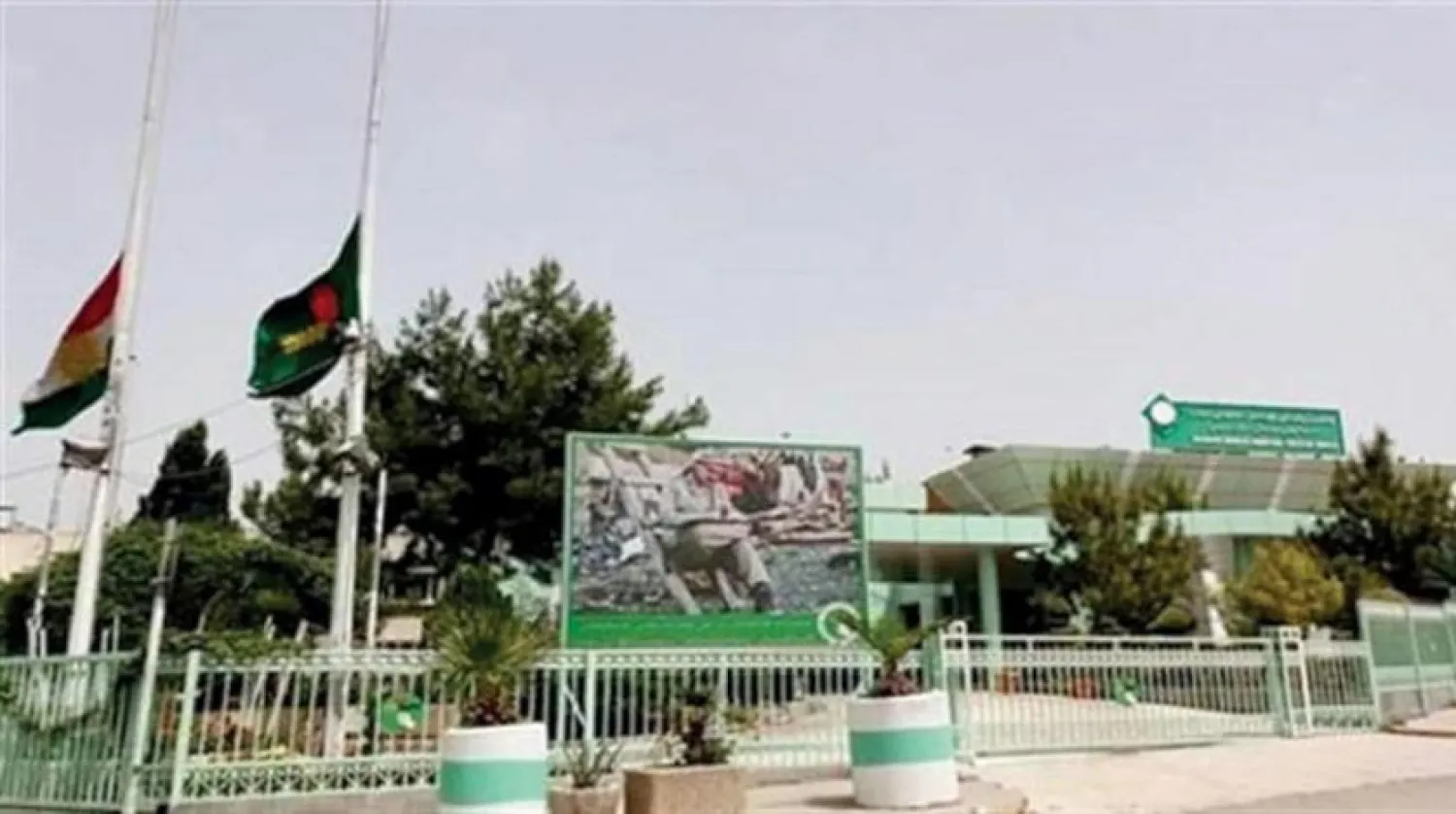 A poster of late Iraqi President Jalal Talabani in front of his party headquarters in Sulaymaniyah. (PUK) 