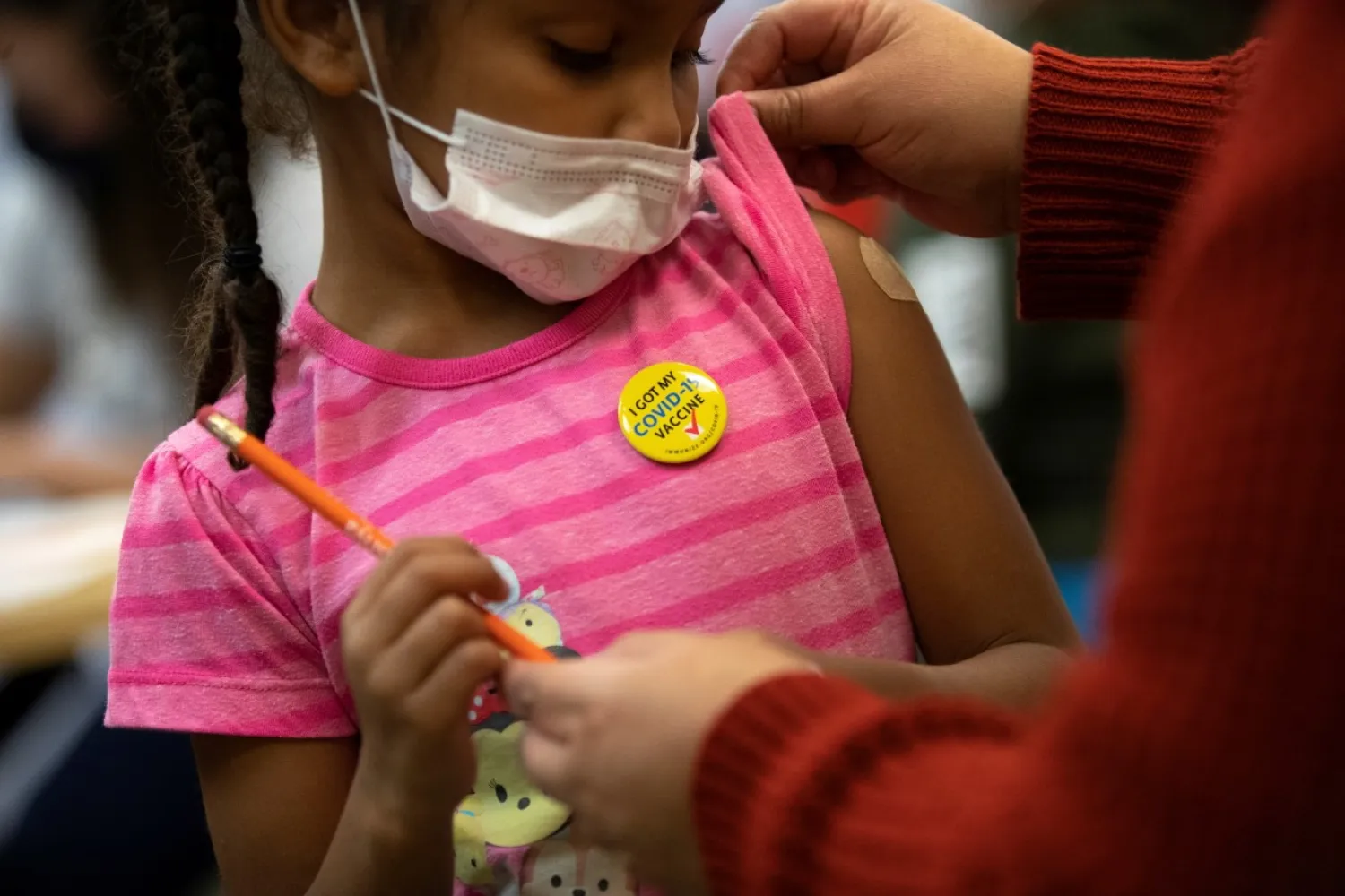 A child after receiving her first dose of COVID-19 vaccine in Washington (Reuters)