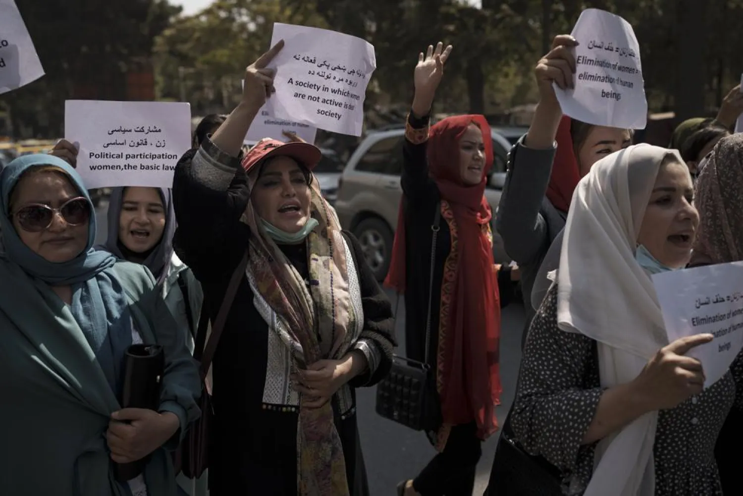 Women march to demand their rights under the Taliban rule during a demonstration near the former Women's Affairs Ministry building in Kabul, Afghanistan, Sunday, Sept. 19, 2021.(AP Photo)
