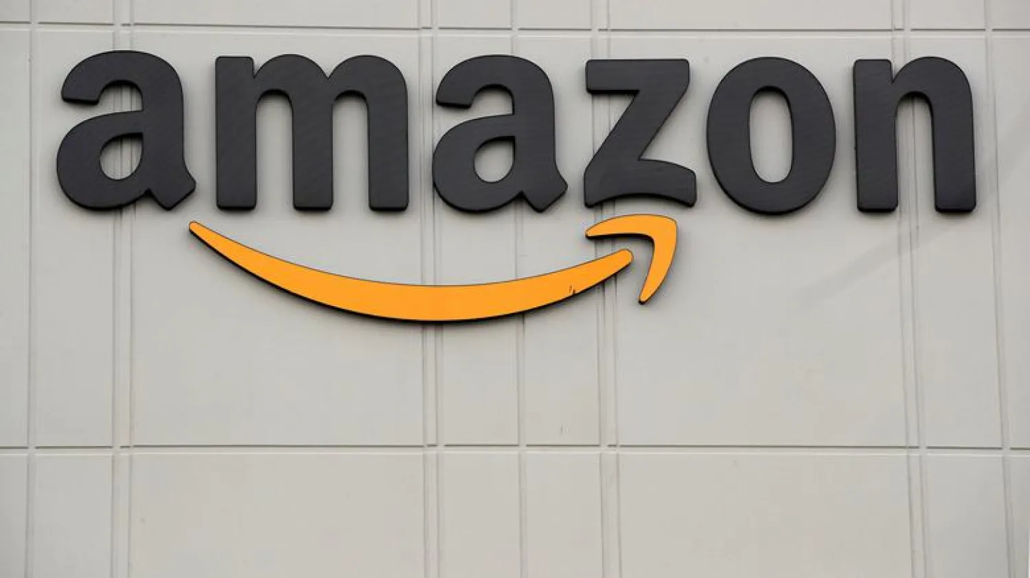 The Amazon logo is seen outside its JFK8 distribution center in Staten Island, New York, US November 25, 2020. REUTERS/Brendan McDermid/File Photo