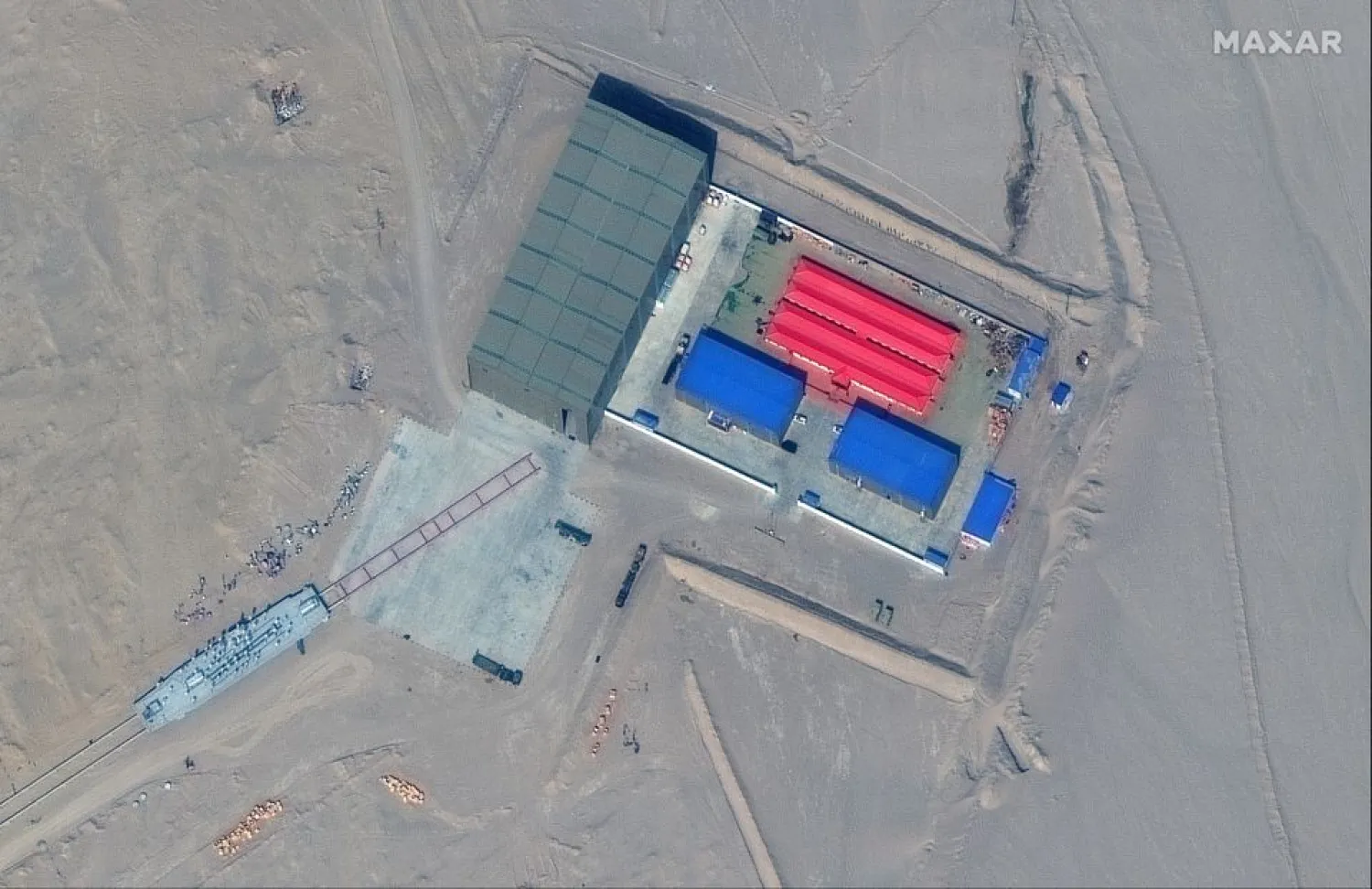 A satellite picture shows a rail terminus and target storage building in Ruoqiang, Xinjiang, China, October 7, 2021. Satellite Image ©2021 Maxar Technologies/Handout via Reuters