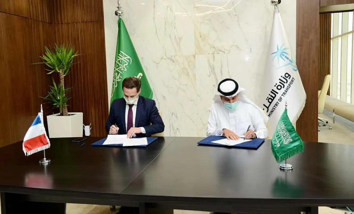 Saudi Minister of Transport Saleh al-Jasser and French Minister of Transport, Jean-Baptiste Djebbari sign the cooperation agreement. (SPA)