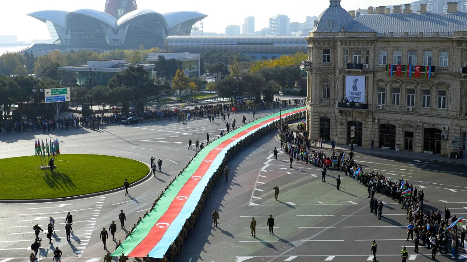Soldiers carry a 440-meter-long (1,444-foot) Azerbaijan national flag to celebrate the Victory Day, in Baku, Azerbaijan, Monday, Nov. 8, 2021. (AP)