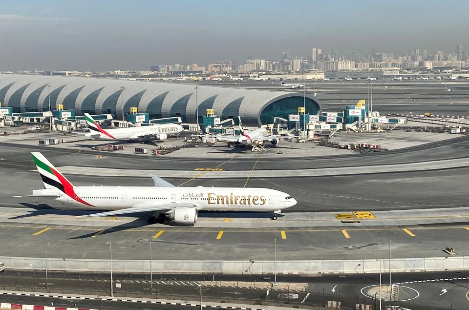 Emirates airliners are seen on the tarmac in a general view of Dubai International Airport in Dubai, United Arab Emirates January 13, 2021. REUTERS/Abdel Hadi Ramahi
