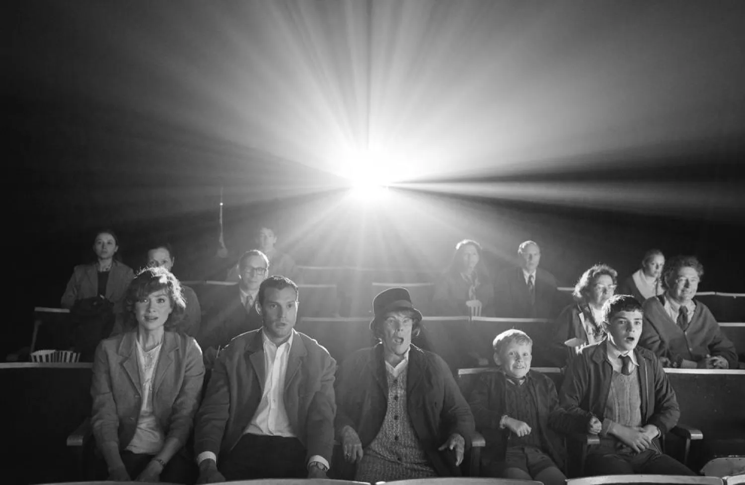 Caitriona Balfe, from left, Jamie Dornan, Judi Dench, Jude Hill and Lewis McAskie appear in a scene from "Belfast." (Focus Features via AP)