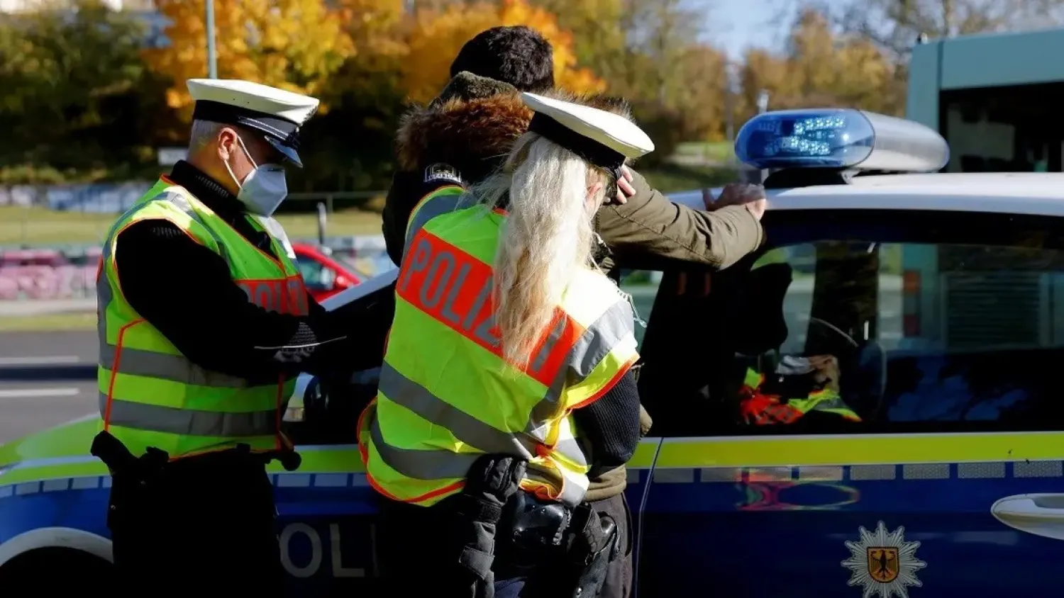 German police officers detain a migrant, reportedly coming from Iraq through Belarus and Poland, during a patrol near the German-Polish border, in Frankfurt (Oder), Germany, October 28, 2021. (Reuters)