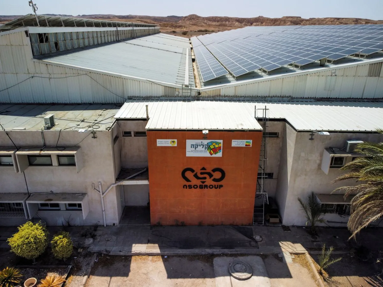 An aerial view shows the logo of Israeli cyber firm NSO Group at one of its branches in the Arava Desert, southern Israel July 22, 2021. Picture taken with a drone. Reuters