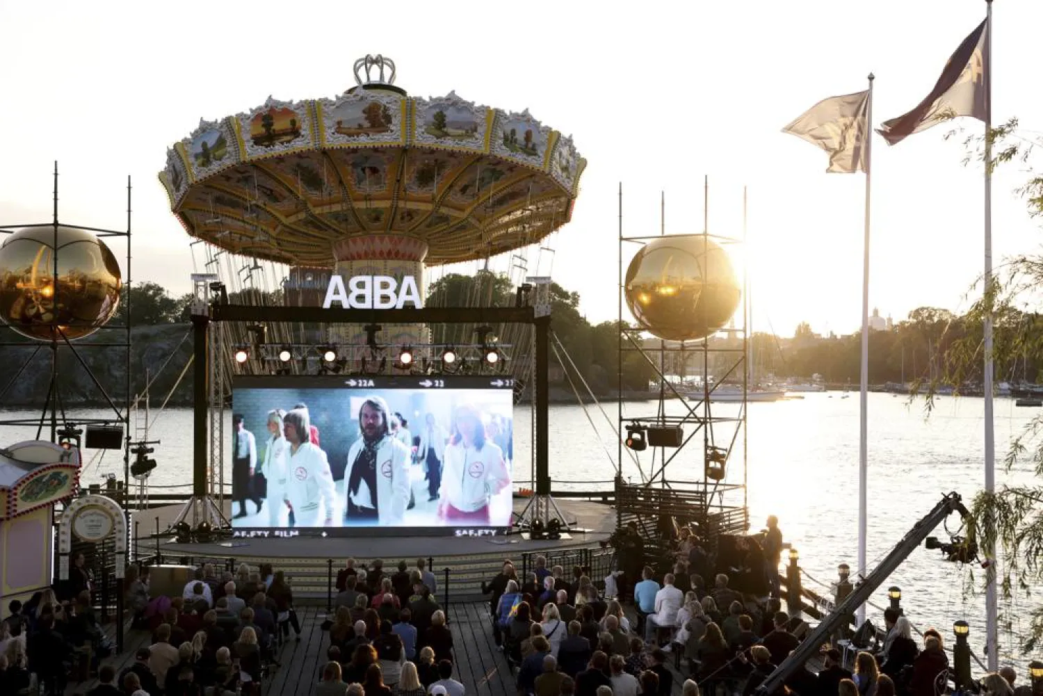 People look at the screen, at the ABBA Voyage event at Grona Lund, in Stockholm, Sweden, Thursday, Sept. 2, 2021. (AP)