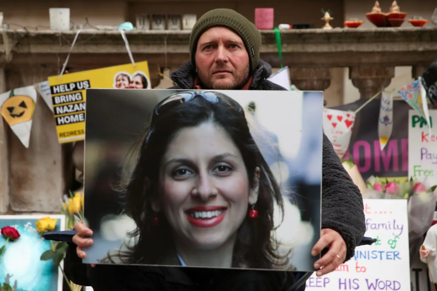 Richard Ratcliffe, husband of British-Iranian aid worker Nazanin Zaghari-Ratcliffe, holds Nazanin's picture during the 19th day of a hunger strike outside the Foreign, Commonwealth and Development Office (FCDO), in London, Britain, November 11, 2021. REUTERS/Peter Cziborra
