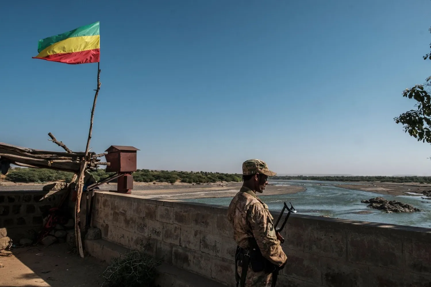 A member of the Amhara Special Forces watches on at the border crossing with Eritrea where an Imperial Ethiopian flag waves, Humera, Ethiopia, Nov. 22, 2020. (AFP)