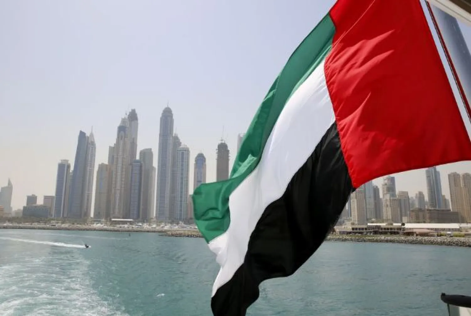 UAE flag flies over a boat at Dubai Marina, Dubai, United Arab Emirates May 22, 2015. REUTERS/Ahmed Jadallah/File Photo/File Photo

