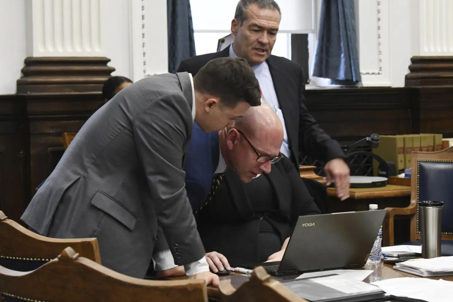 Kyle Rittenhouse and defense attorneys Corey Chirafisi, center, and Mark Richards argue about a video during Kyle Rittenhouse's trial at the Kenosha County Courthouse in Kenosha, Wis., on Friday, Nov. 12, 2021. (Mark Hertzberg /Pool Photo via AP)
