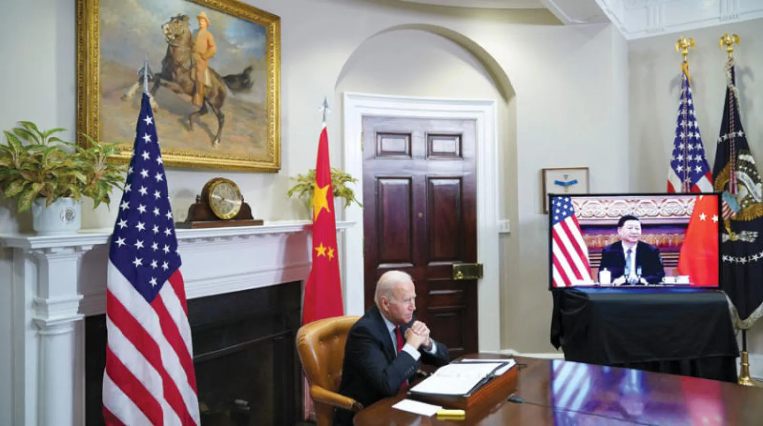 الرئيس بايدن خلال القمة الافتراضية مع الرئيس شي ليلة الاثنين - الثلاثاء (أ.ف.ب)