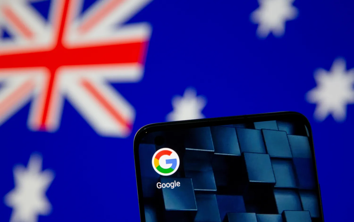 A smartphone with a Google app icon is seen in front of the displayed Australian flag in this illustration, January 22, 2021. REUTERS/Dado Ruvic/Illustration

