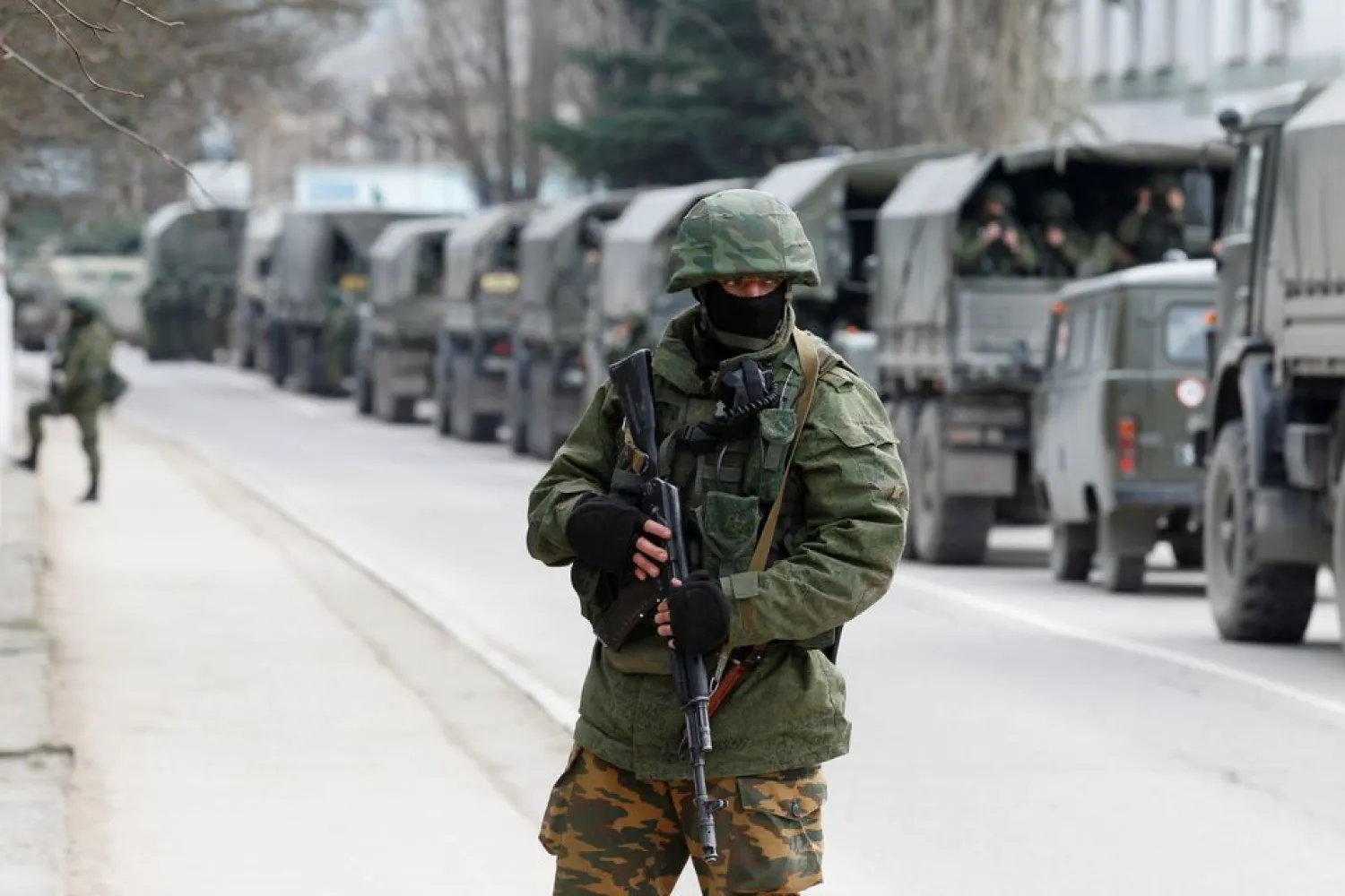 Armed servicemen wait in Russian army vehicles outside a Ukranian border guard post in the Crimean town of Balaclava March 1, 2014. (Reuters)
