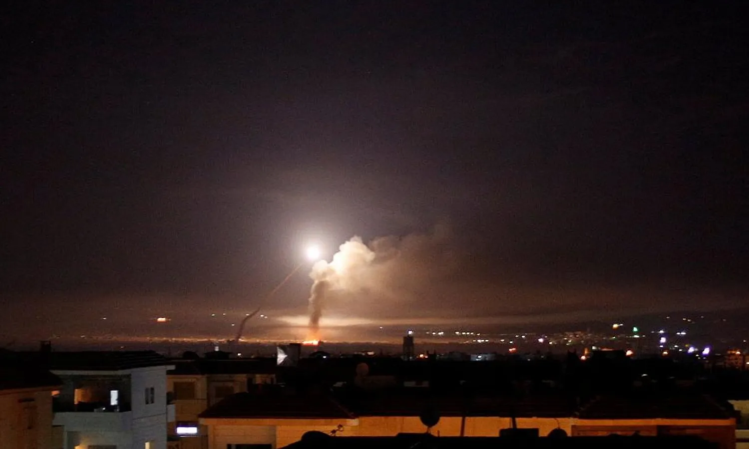 Syrian regime's surface-to-air missile launchers attempt to intercept an Israeli airstrike. Reuters file photo