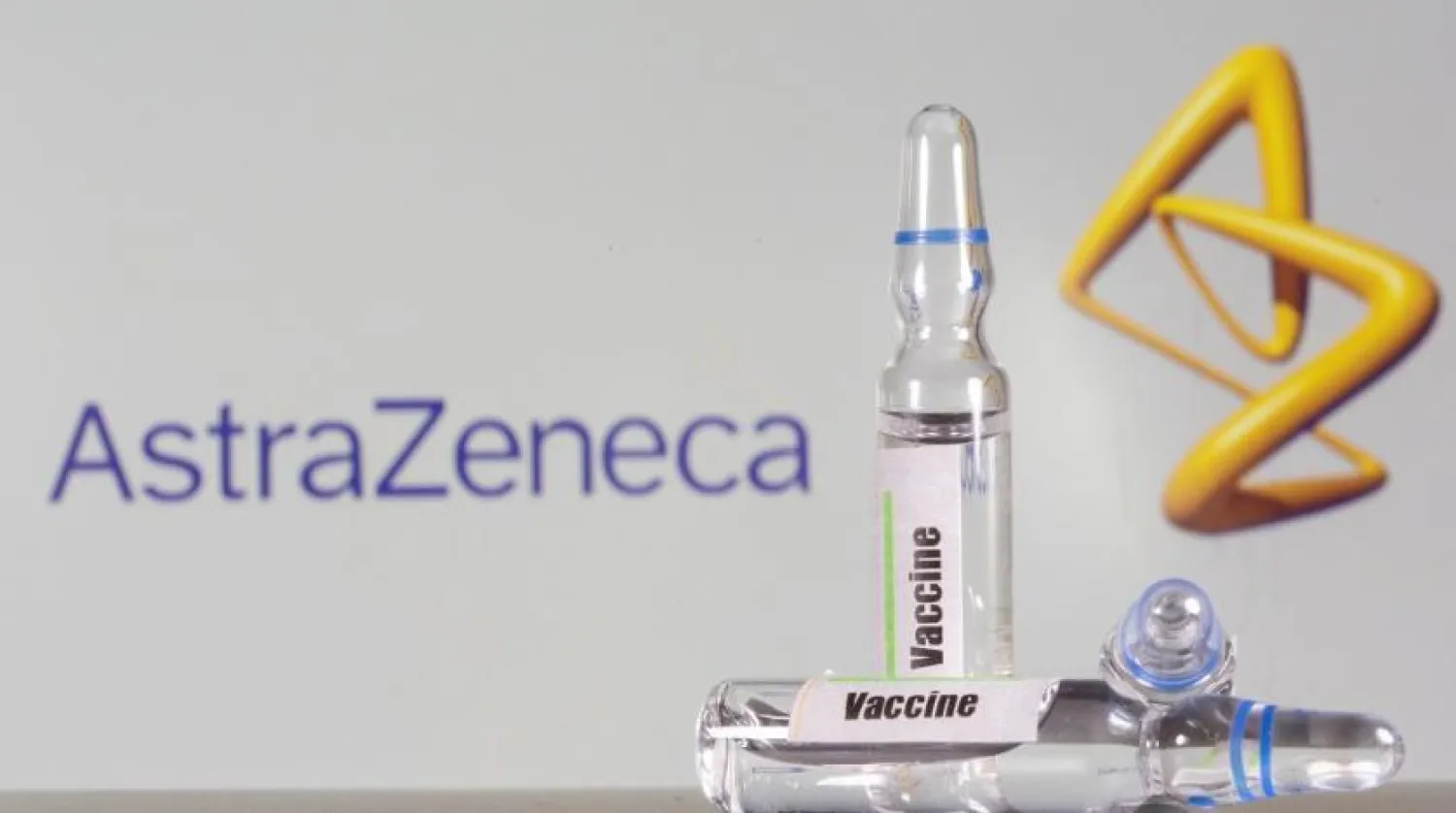 A test tube labeled with the Vaccine is seen in front of AstraZeneca logo in this illustration taken, September 9, 2020. (Reuters)
