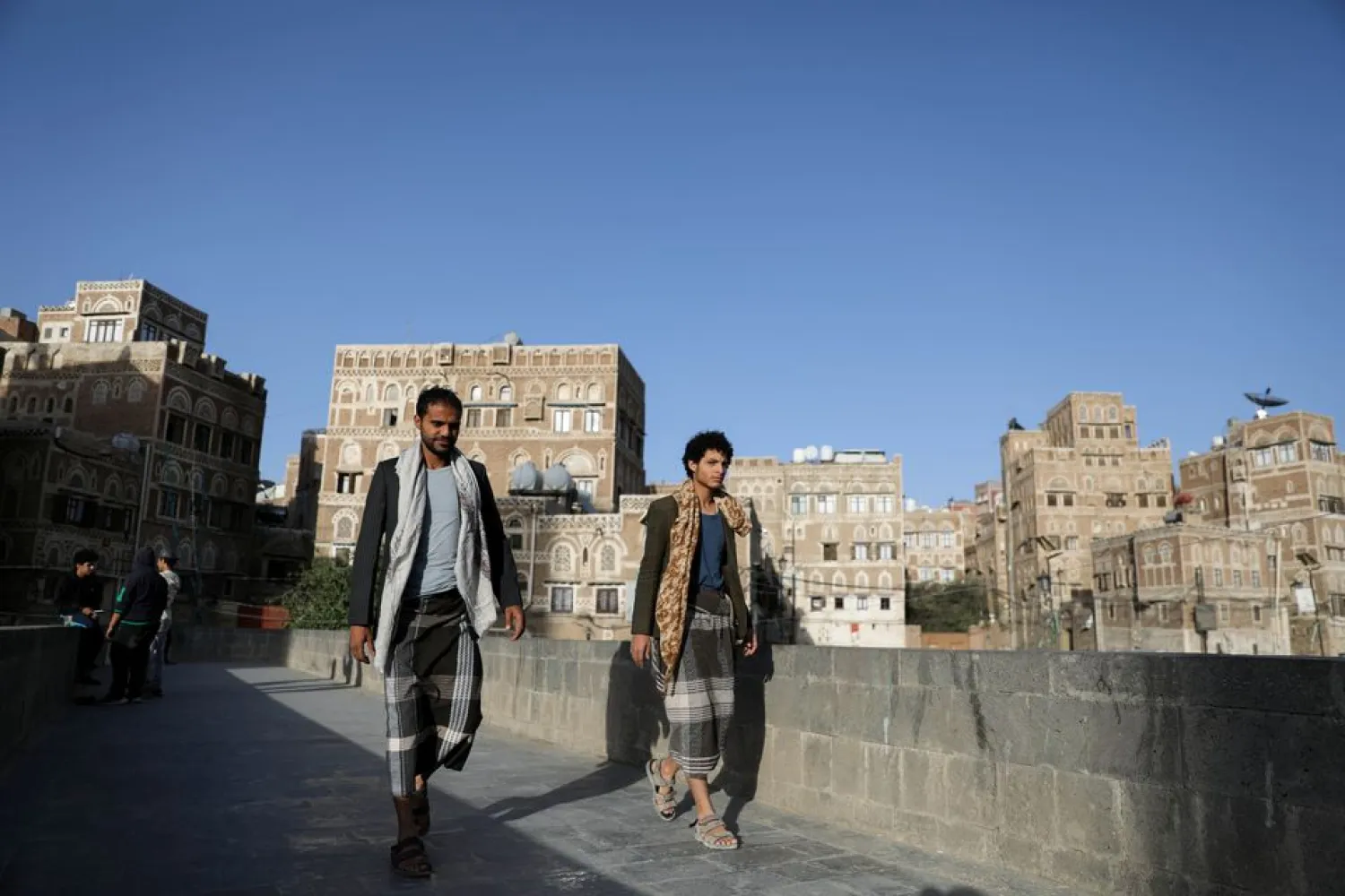 People walk in the old quarter of Sanaa, Yemen March 22, 2021. (Reuters)