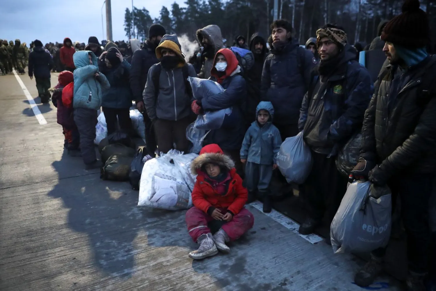 Migrants gather at a transport and logistics center near the Belarusian-Polish border in the Grodno region, Belarus, November 18, 2021. (Reuters)
