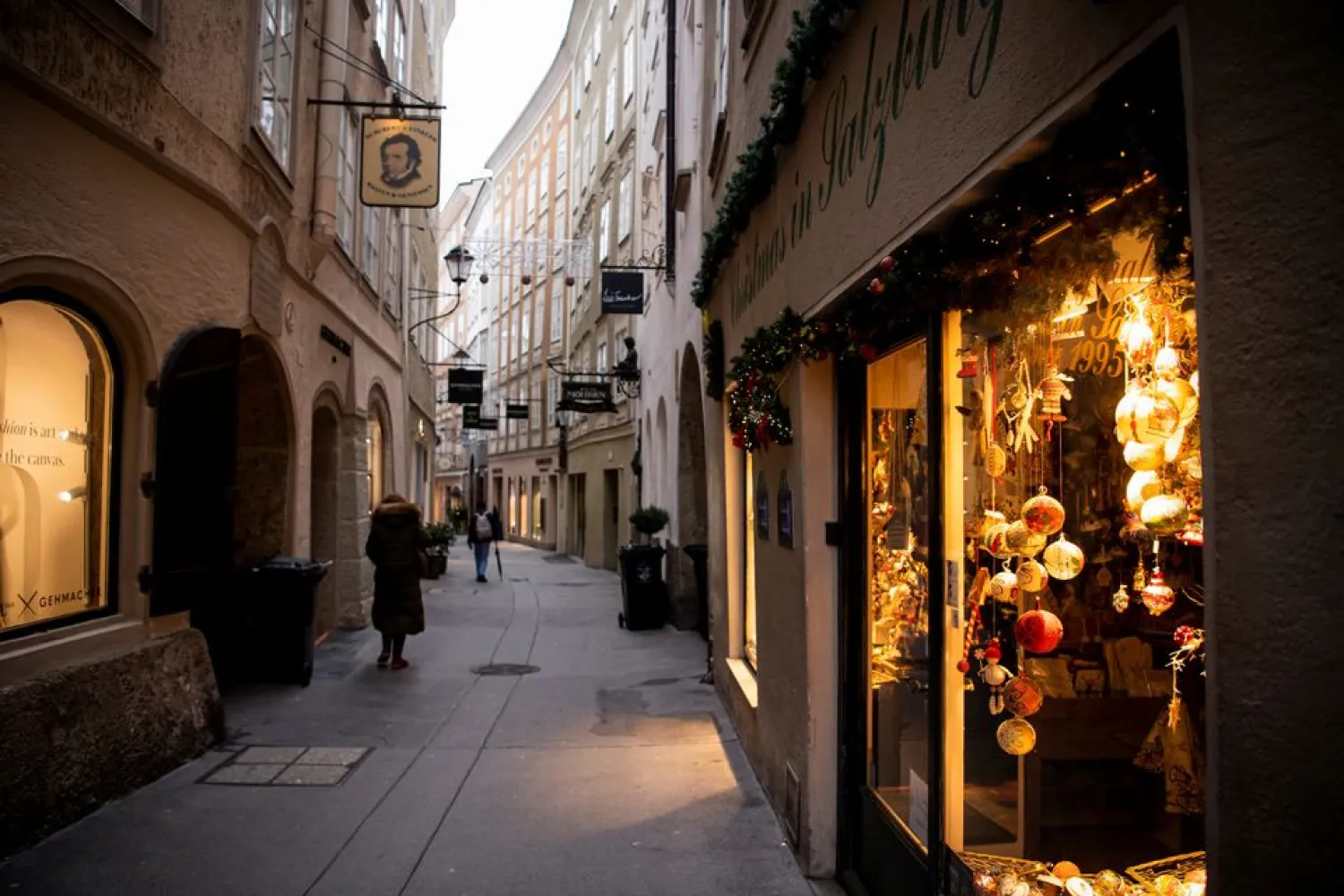 Pedestrians walk at the city center during the coronavirus disease (COVID-19) outbreak, as Austria's government imposed a general lockdown from Monday, in Salzburg, Austria, November 22, 2021. (Reuters)