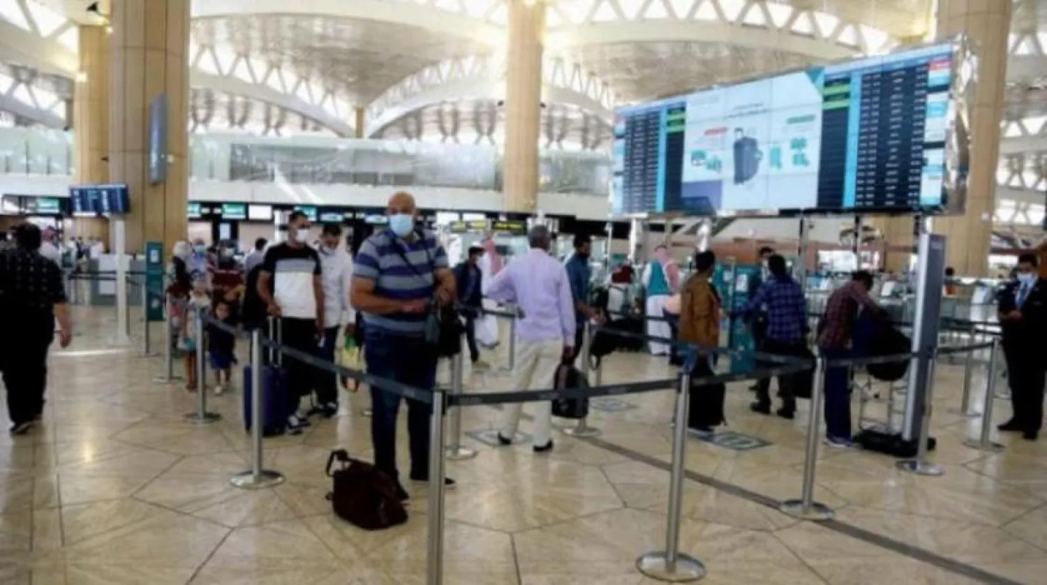 Travelers are seen at the King Khalid International Airport in Riyadh. Photo by Saad al-Dossary