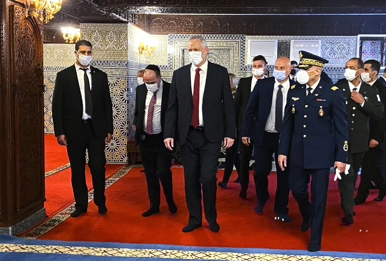 Israeli Defense Minister Benny Gantz, center, visits the Mausoleum of King Mohammed V, in Rabat, Morocco, Wednesday, Nov. 24 2021. (AP Photo/Ilan Ben Zion)