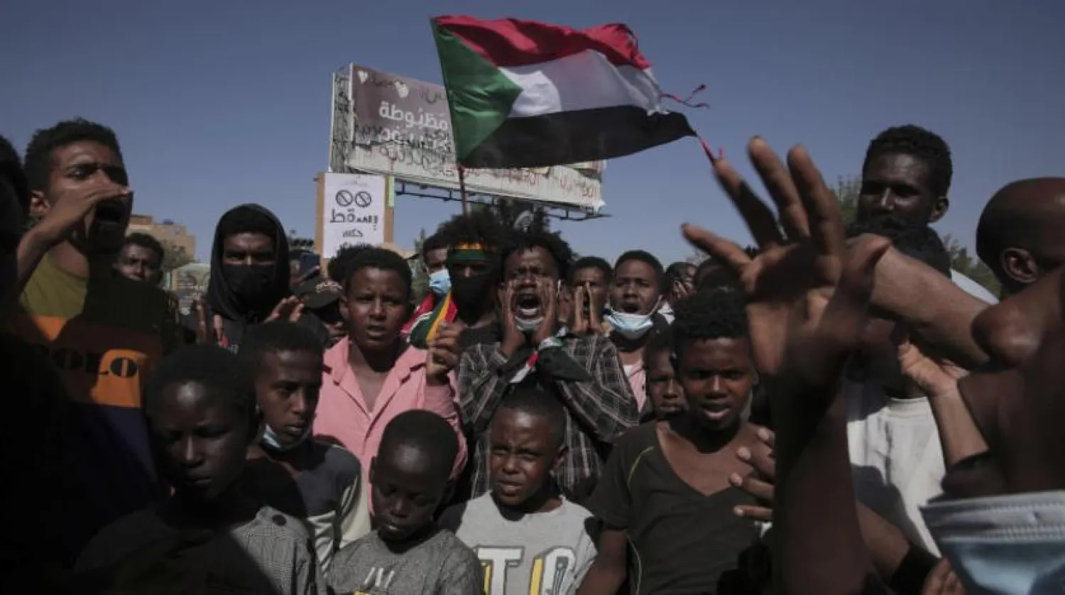 Thousands of protesters take to the streets to renew their demand for a civilian government in the Sudanese capital Khartoum, Thursday, Nov. 25, 2021. (AP Photo/Marwan Ali)