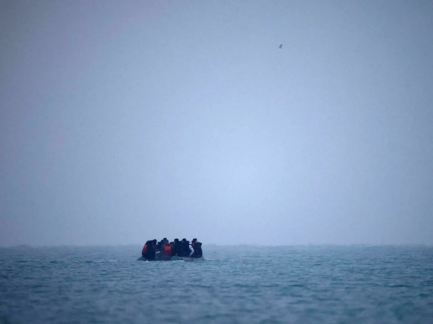 Migrants on an inflatable dinghy leave the coast of northern France to cross the English Channel, near Wimereux, France, November 24, 2021. Gonzalo Fuentes, Reuters