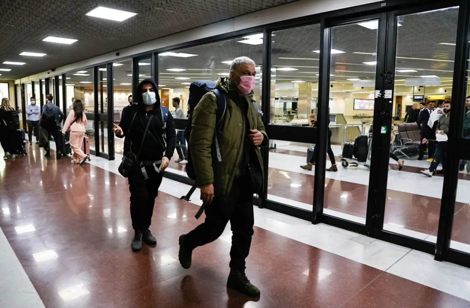 Iraqi migrants, who voluntarily registered for an evacuation flight from Belarus, arrive at Baghdad International Airport, in Baghdad, Iraq, November 18, 2021. REUTERS/Ahmed Saad


