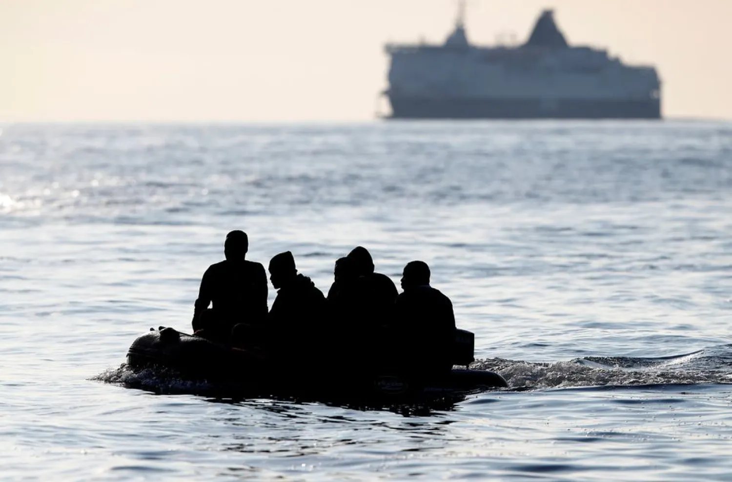Migrants cross the English Channel in an inflatable boat near Dover, Britain, August 4, 2021. REUTERS/Peter Nicholls