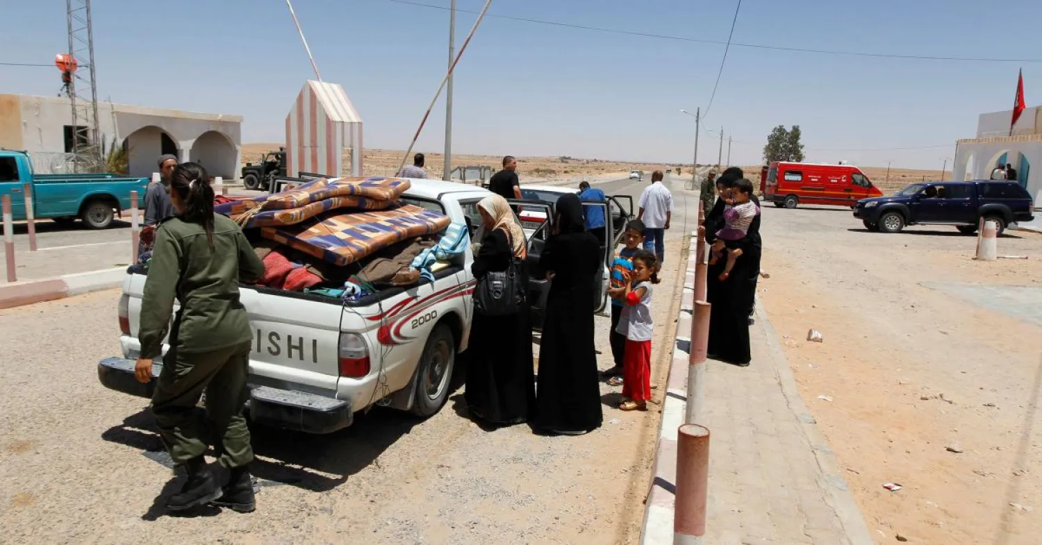 Libyans at the Libyan-Tunisia border crossing in Dehiba. (Reuters)