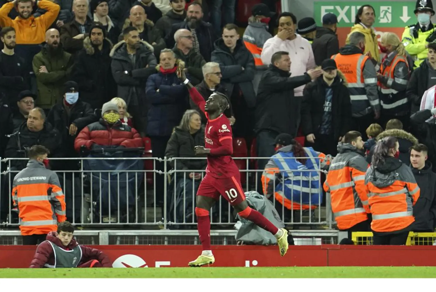 Liverpool's Sadio Mane celebrates after scoring his side's opening goal during the Premier League match between Liverpool and Arsenal at Anfield Stadium, Liverpool, England, Saturday, Nov. 20, 2021. (AP)
