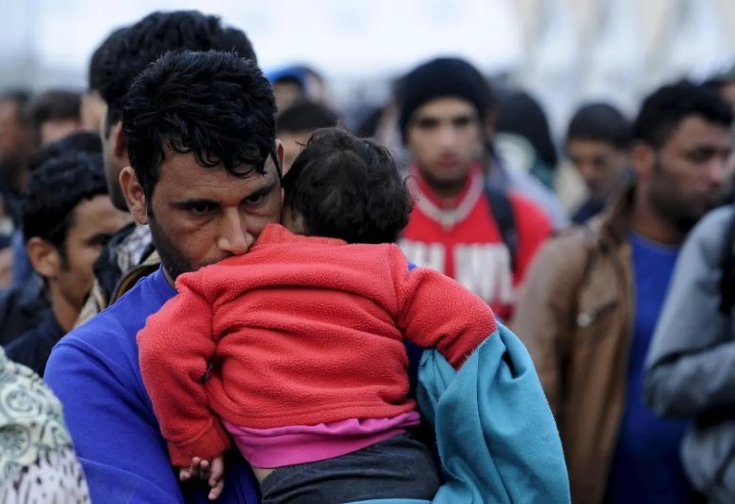 FILE: Migrants wait for transport at a transit camp in Gevgelija, Macedonia, after entering the country by crossing the border with Greece, September 24, 2015. REUTERS/Ognen Teofilovski


