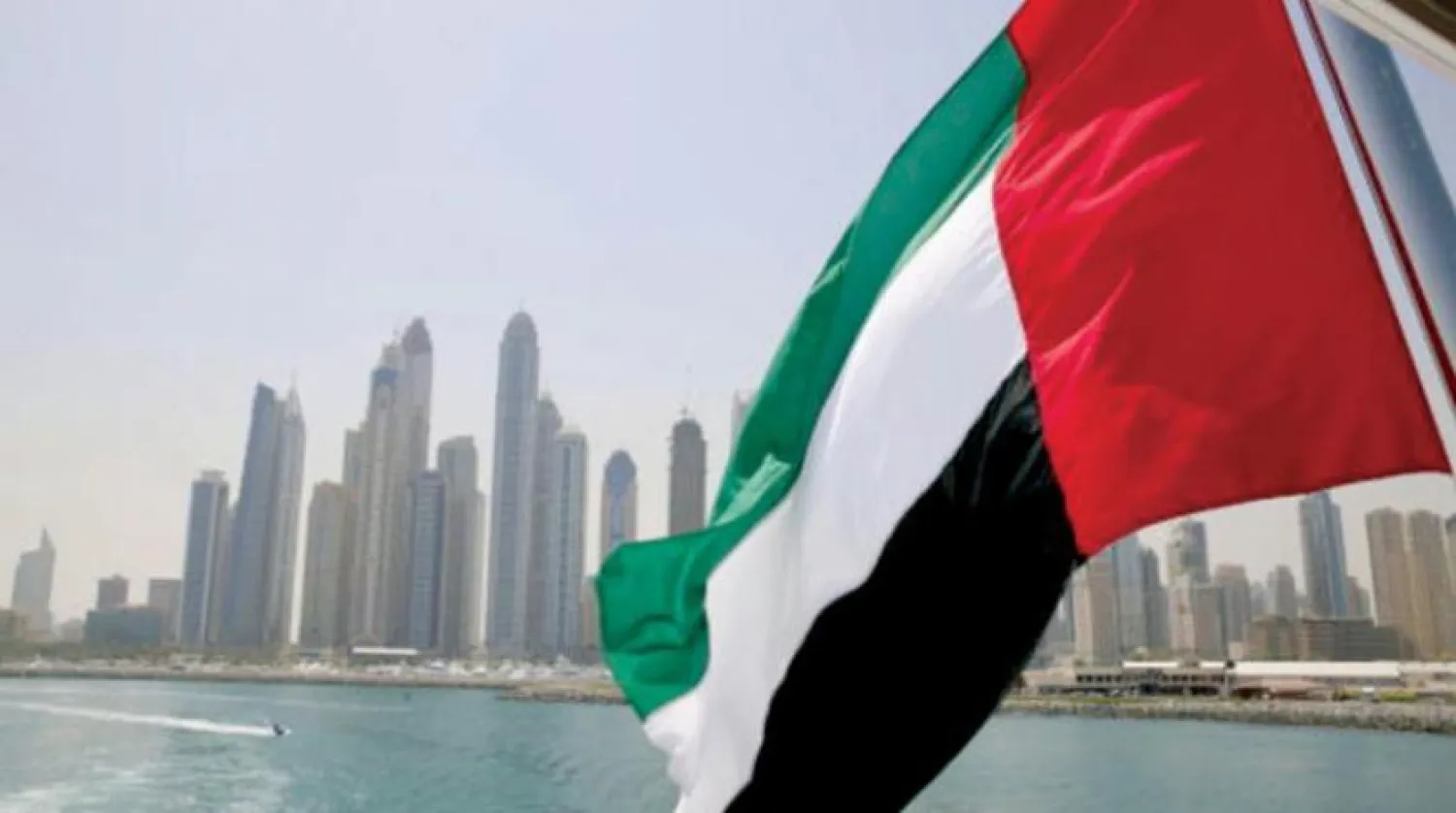UAE flag flies over a boat at Dubai Marina, Dubai, United Arab Emirates May 22, 2015. REUTERS/Ahmed Jadallah