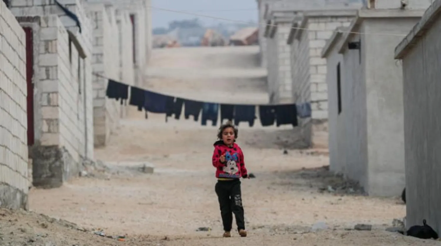  A displaced girl in the countryside of Idlib, northwest Syria, on Saturday, November 27, 2021. (AFP) 
