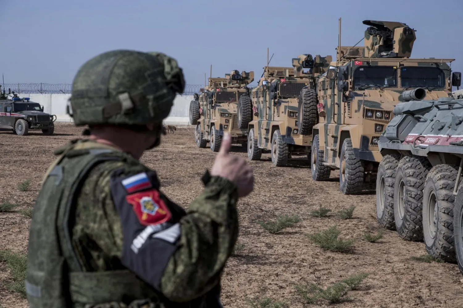 A Turkish and Russian patrol is seen near the town of Darbasiyah, Syria, Friday, Nov. 1, 2019. (AP)