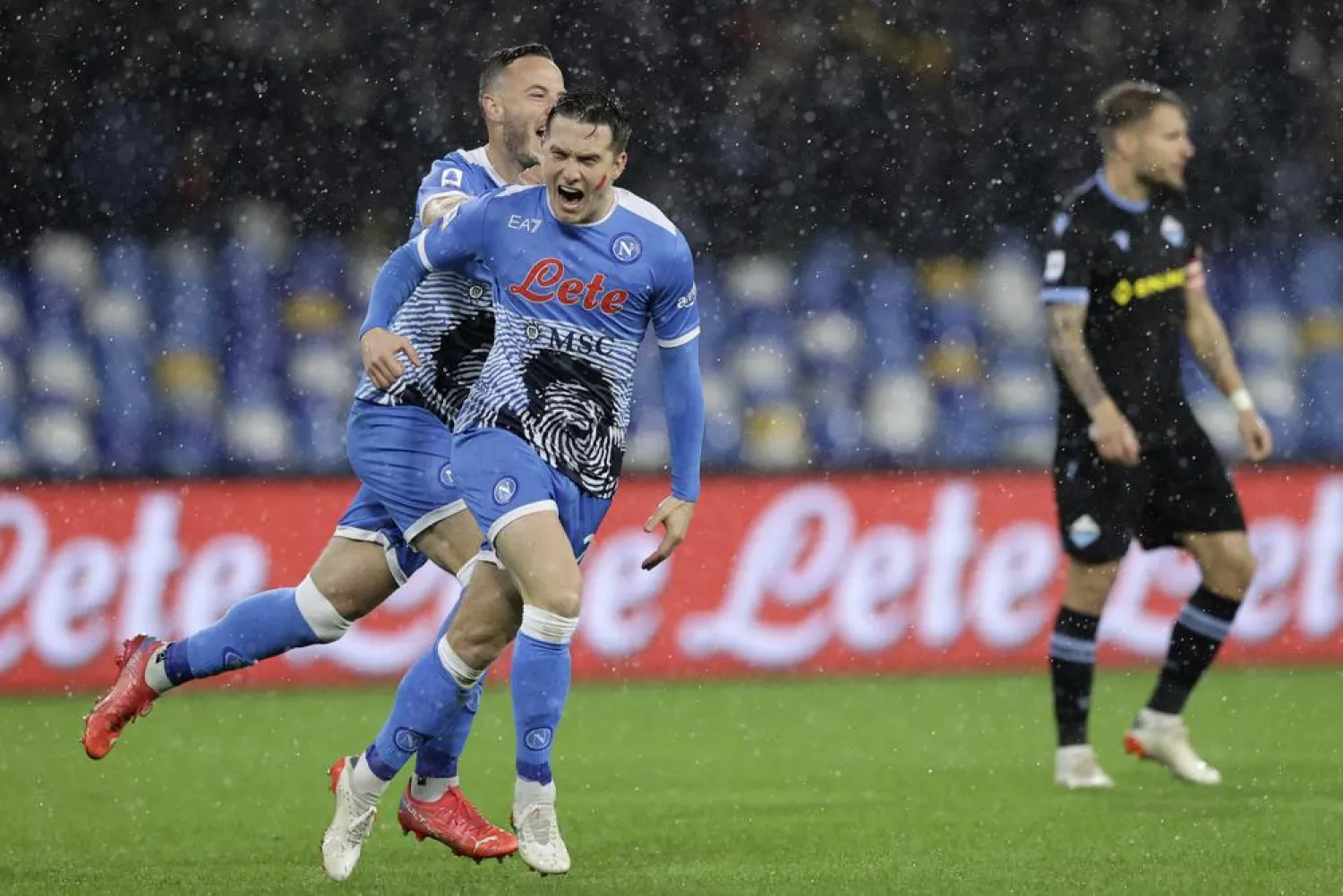 Napoli's Piotr Zielinski celebrates after scoring his side's opening goal, during the Serie A match between Napoli and Lazio, at the Diego Armando Maradona stadium in Naples, Italy, Sunday, Nov. 28, 2021. (AP)