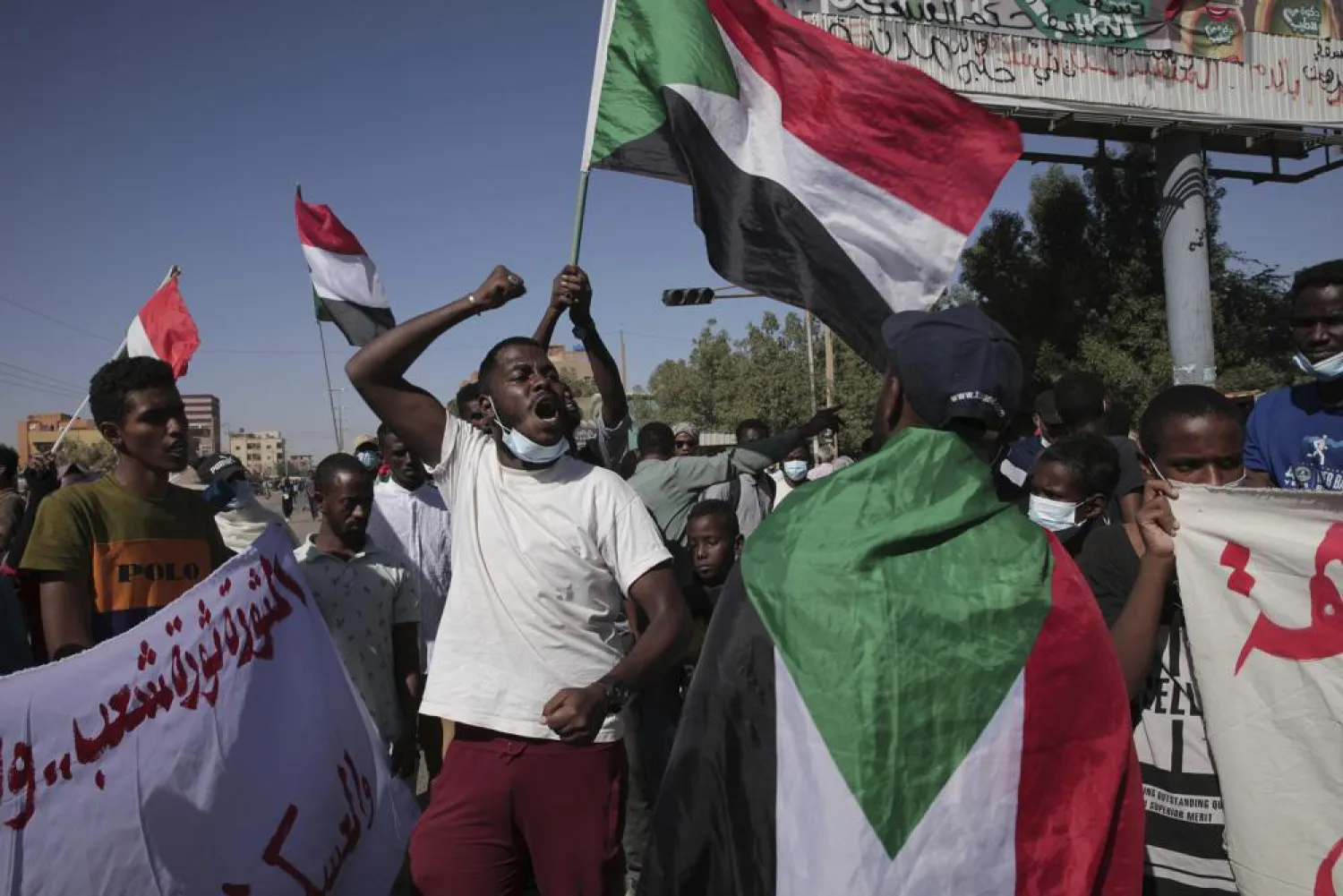 Thousands of protesters take to the streets to renew their demand for a civilian government in the Sudanese capital Khartoum, Thursday, Nov. 25, 2021. (AP)