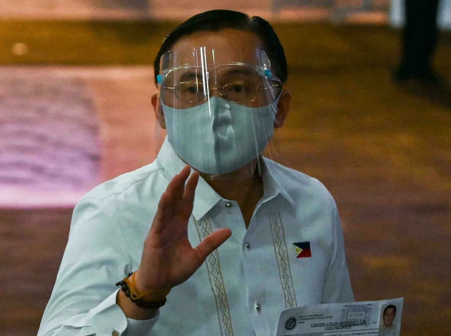 His sudden exit narrows the field of candidates vying to replace Duterte LISA MARIE DAVID POOL/AFP
