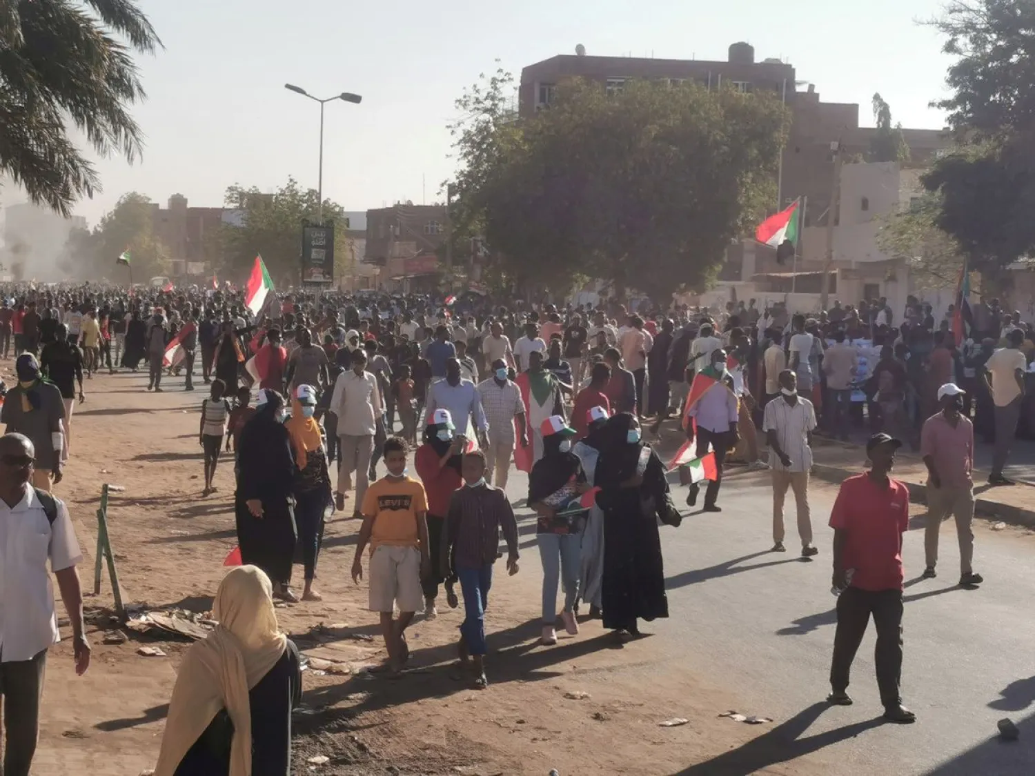 People hold Sudanese flags during a protest, in Khartoum, Sudan, November 25, 2021. (Reuters)