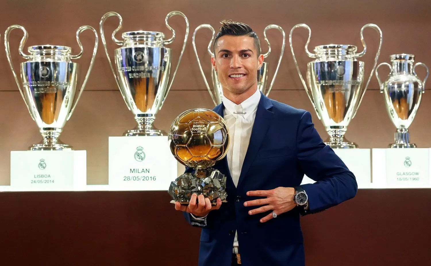 Ronaldo poses with his fourth Ballon d'Or trophy. (EPA)