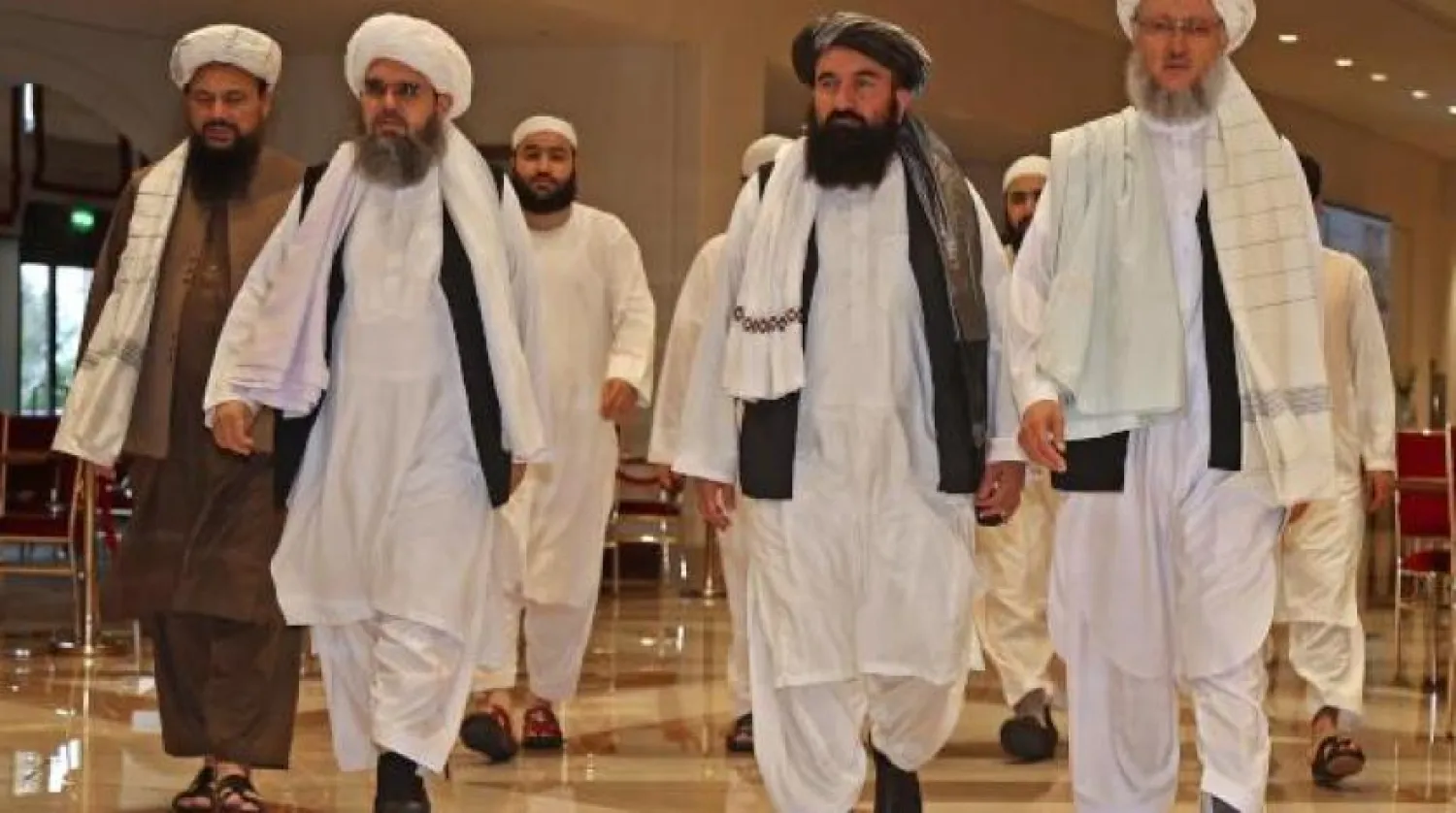 Taliban heyeti, Ağustos ayında Doha’da ABD heyeti ile yaptığı görüşmeler sırasında (AFP)