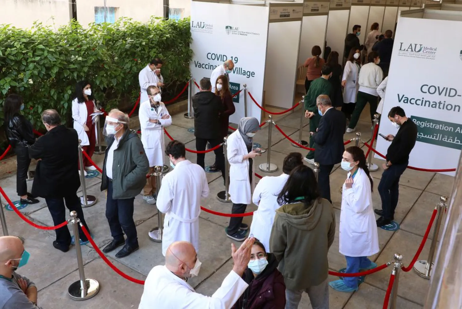 Healthcare workers wait to receive the Pfizer/BioNTech COVID-19 vaccine during a coronavirus vaccination campaign at Lebanese American University Medical Center-Rizk Hospital in Beirut, Lebanon February 16, 2021. (Reuters)