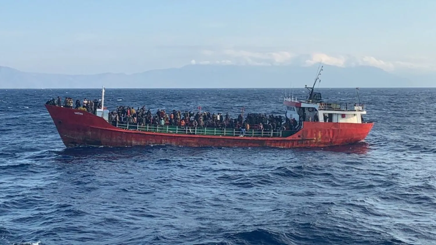 A cargo ship carries migrants during a rescue operation, as it sails off the island of Crete, Greece, October 29, 2021. Hellenic Coast Guard/Handout via REUTERS

