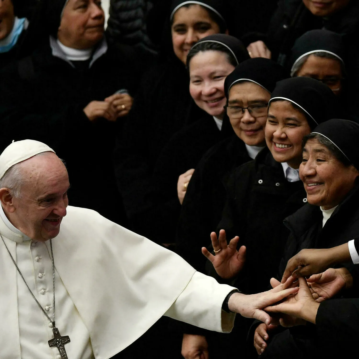Pope Francis salutes nuns at the end of his general audience at the Vatican's Paul VI Hall on December 1, 2021, ahead of his departure for Cyprus. Filippo MONTEFORTE AFP
