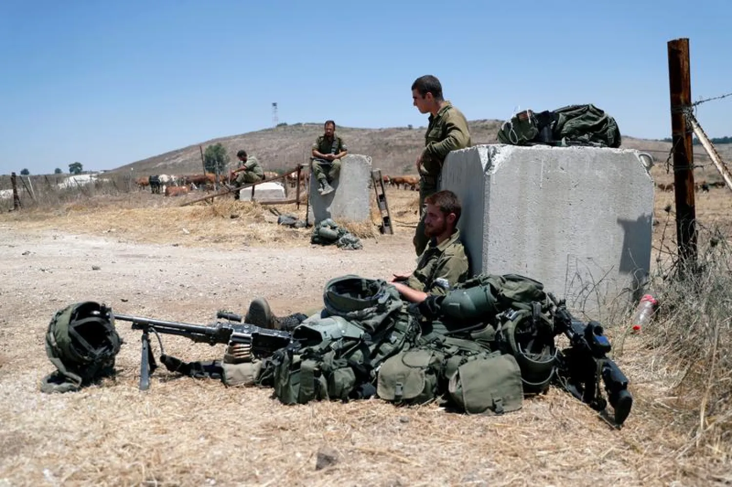 Israeli soldiers near the border with Syria (Reuters)
