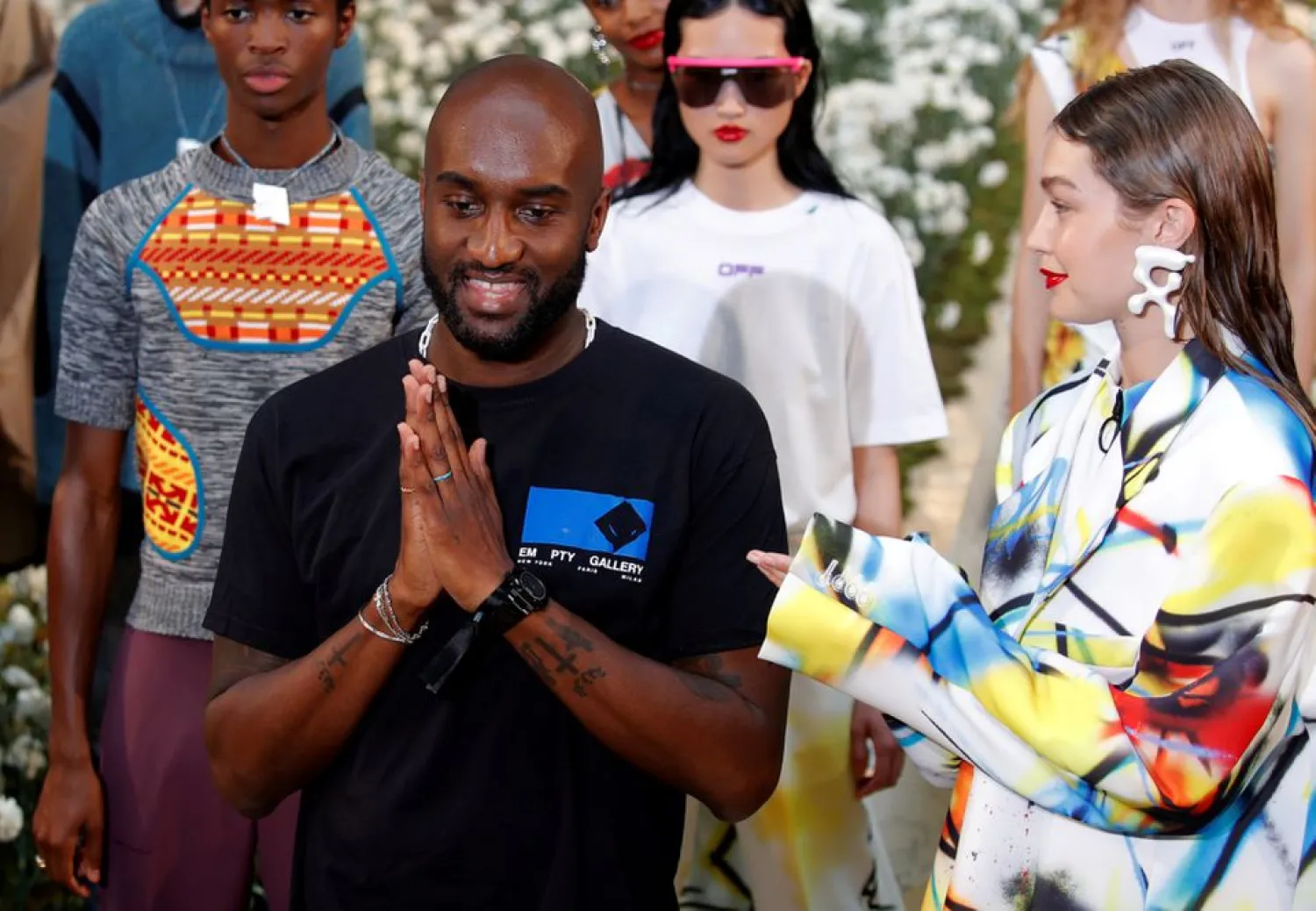 Designer Virgil Abloh appears with model Gigi Hadid at the end of his Spring/Summer 2020 collection show for his label Off-White during Men's Fashion Week in Paris, France, June 19, 2019. 