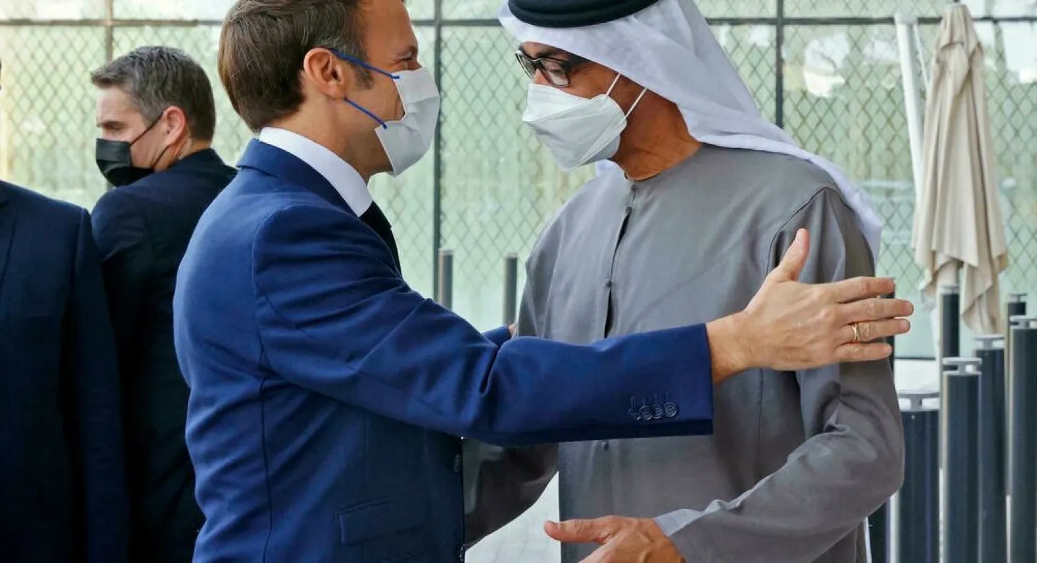 French President Emmanuel Macron (L) is greeted by Abu Dhabi's Crown Prince Mohammed bin Zayed al-Nahyan at the Dubai Expo on the first day of his Gulf tour Thomas SAMSON AFP
